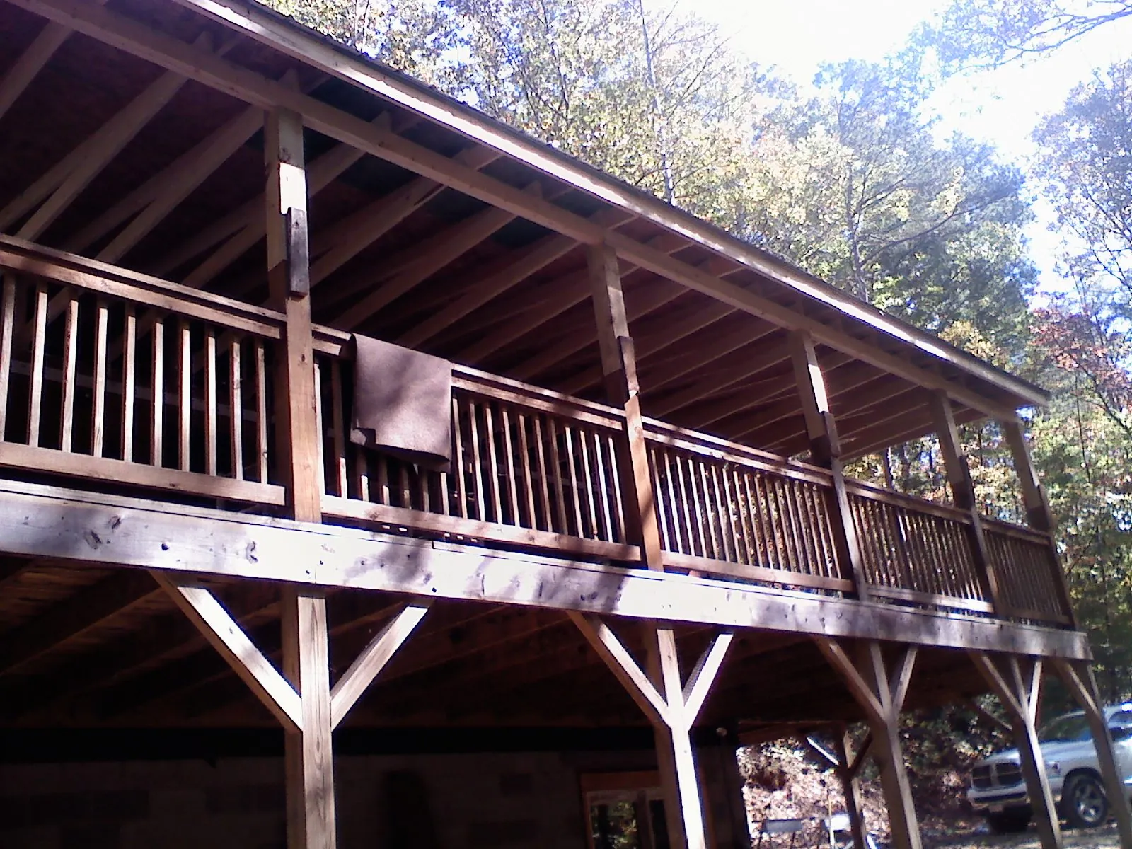 Timber framing under a new elevated porch and deck — Roof Leak Repair in New York by Roofing Brothers
